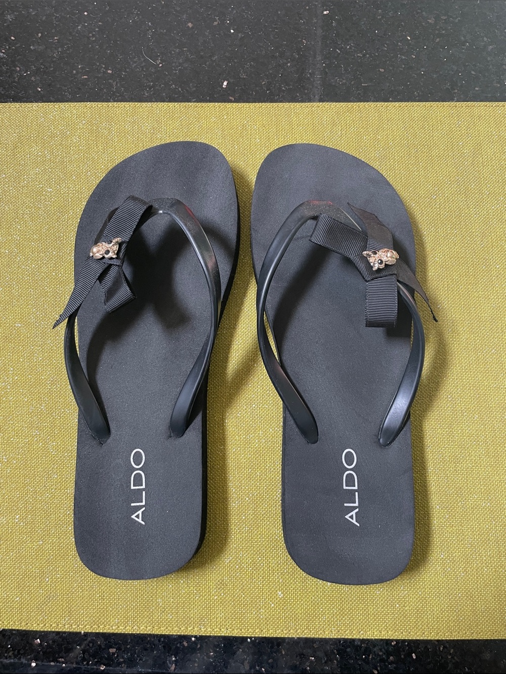ALDO Black Bow Flip Flops with Gold Accent